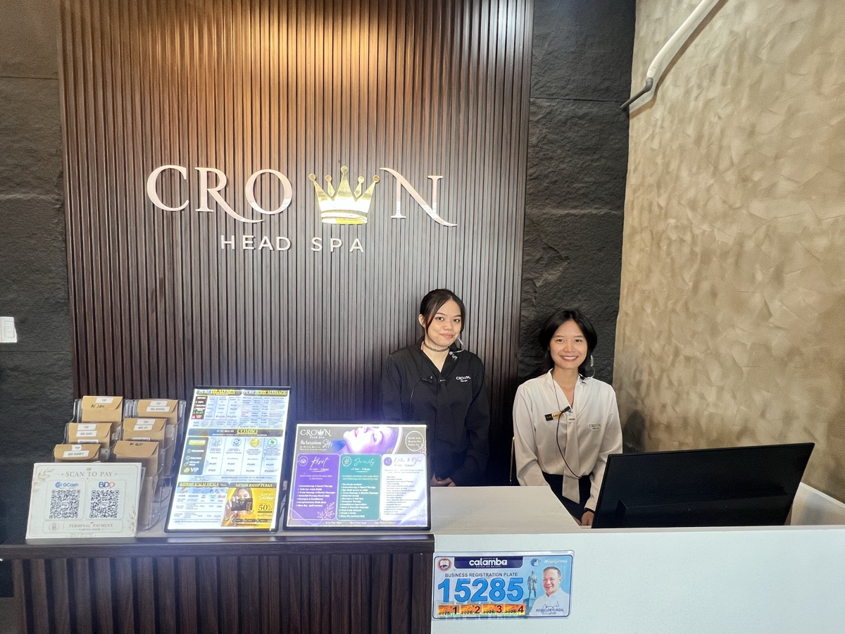 Wide view of staff welcoming guests at reception