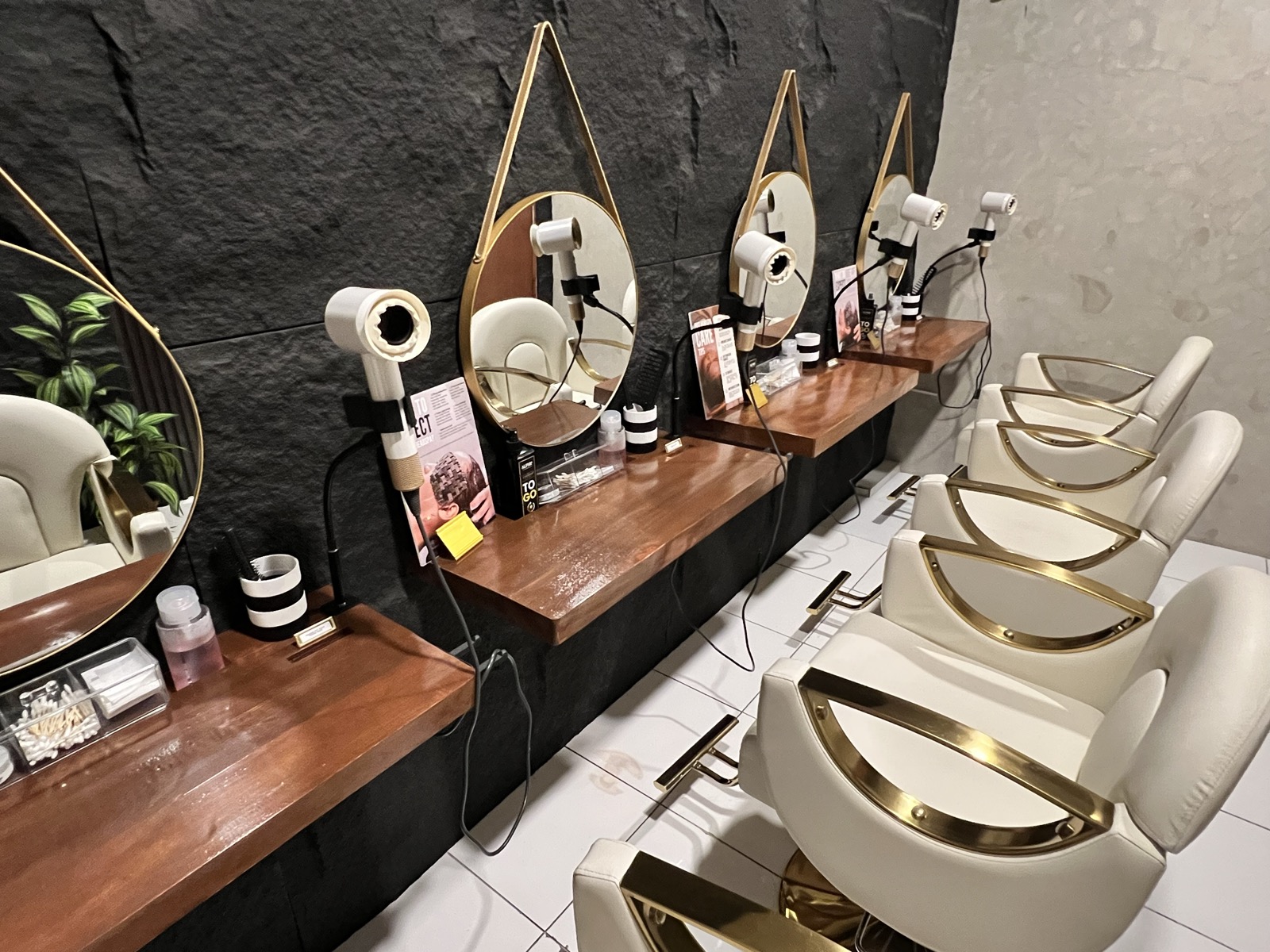 Styling station detail with black stone wall