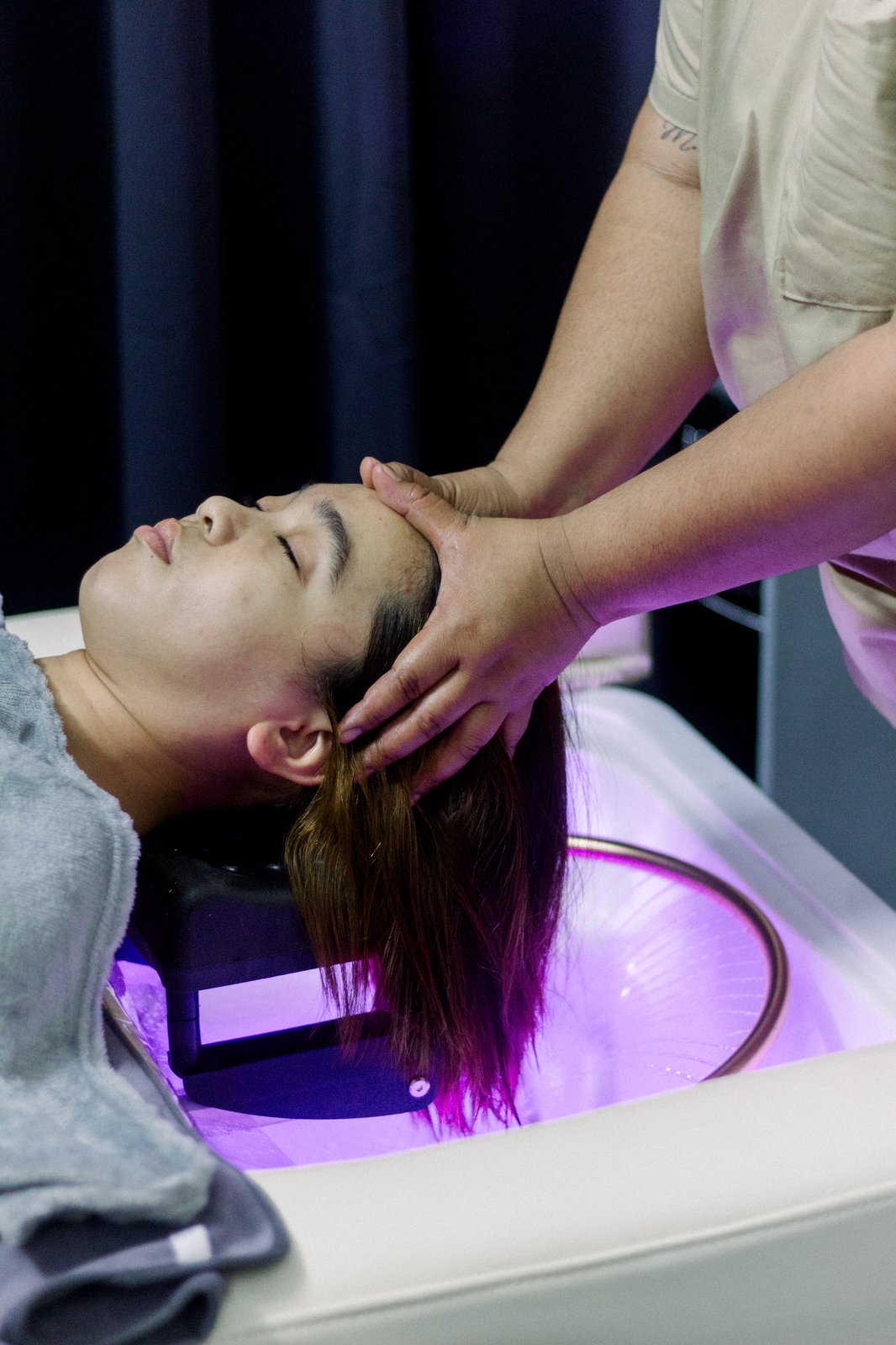 Therapist massaging a client's scalp