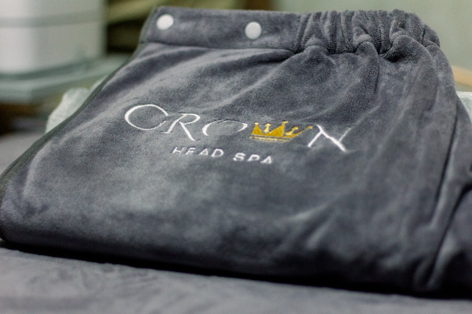 Crown Head Spa branded towel detail